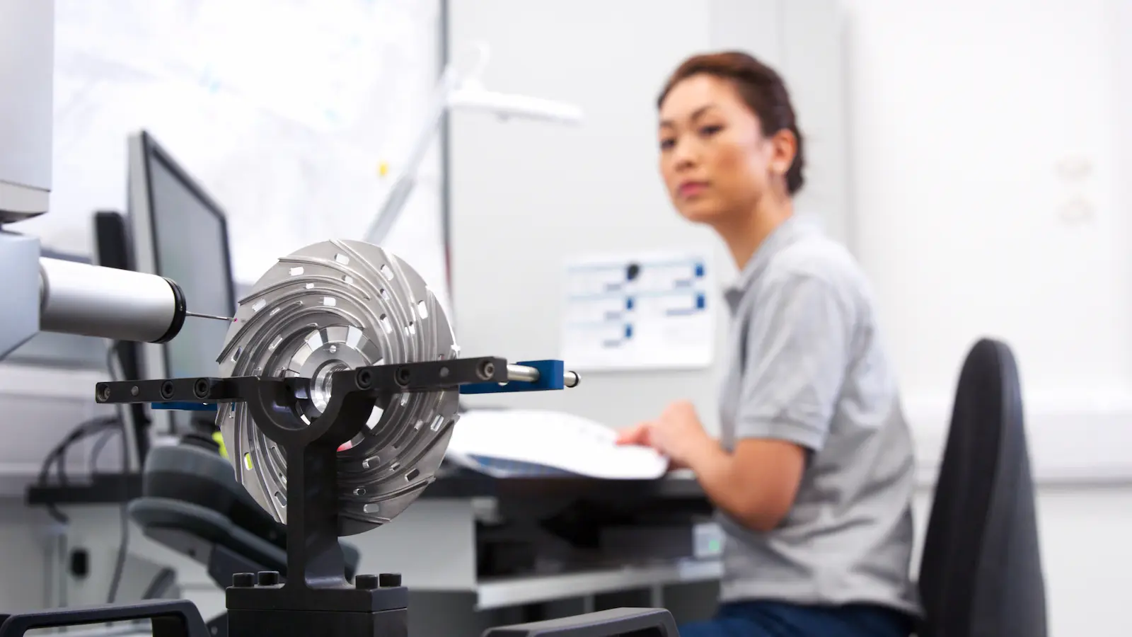 Quality inspector measuring a precision part