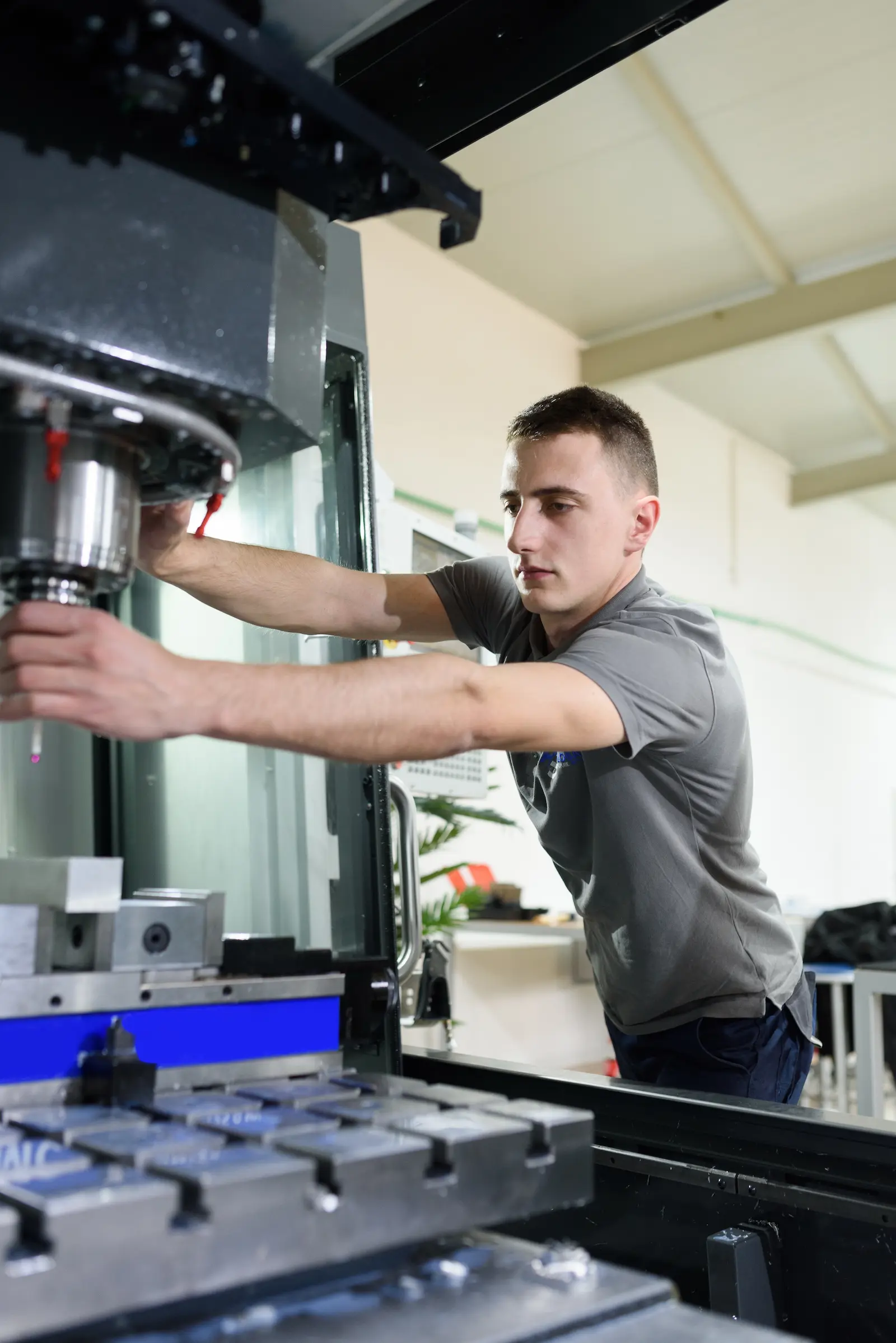 CNC machinist loading a tool